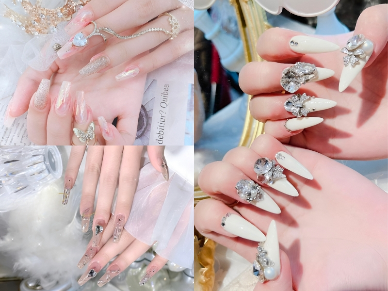Bộ móng tay dài, trang trí với đá quý và hoa văn tinh xảo, nổi bật trên nền màu nhạt và sáng.