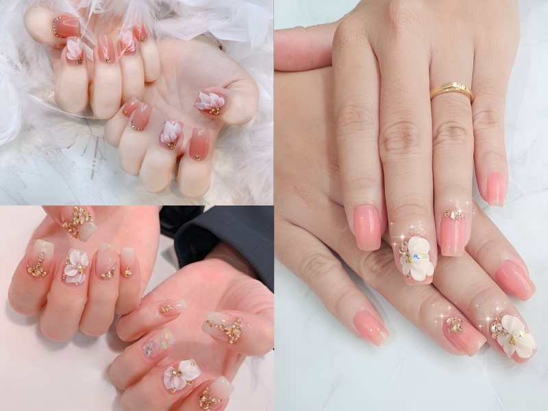 Bộ móng tay được trang trí với hoa 3D và đá quý, tạo nên vẻ đẹp tinh tế và sang trọng cho bàn tay.