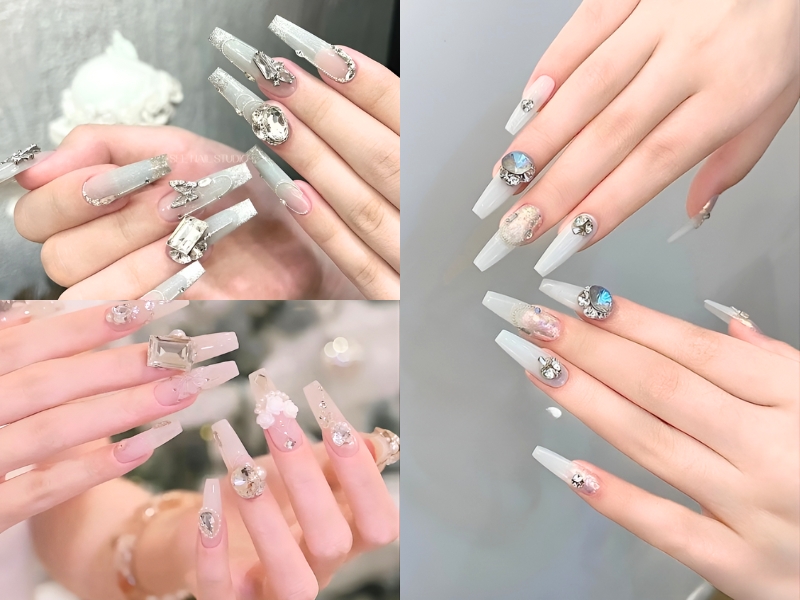 Bộ móng tay dài được trang trí với đá quý lấp lánh và các họa tiết nghệ thuật tinh xảo.