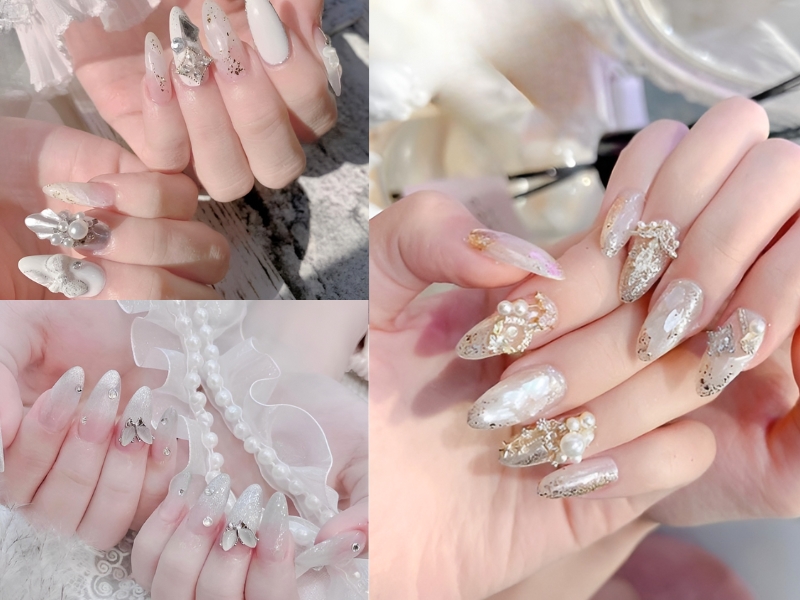 Bàn tay với móng tay được trang trí họa tiết tinh xảo, đính đá và hoa văn lấp lánh.