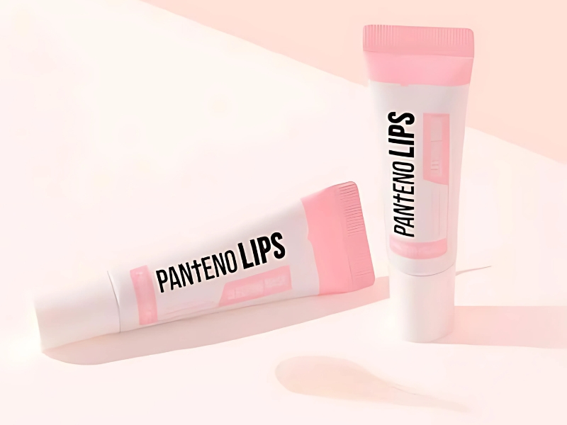 Son dưỡng Mediheal Hai tuýp son dưỡng môi màu trắng và hồng, có chữ "PANTENO LIPS" trên bao bì, nằm trên nền sáng.