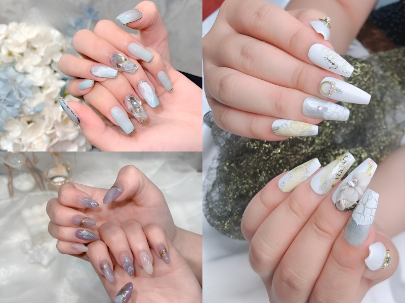 Bộ sưu tập móng tay được trang trí với màu sắc và họa tiết khác nhau, bao gồm đính đá và hoa văn tinh tế.