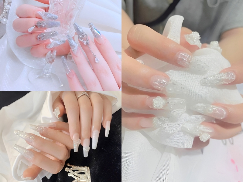 Bộ móng tay dài được trang trí với đá quý và hoa văn phức tạp trên nền trắng và ánh bạc.
