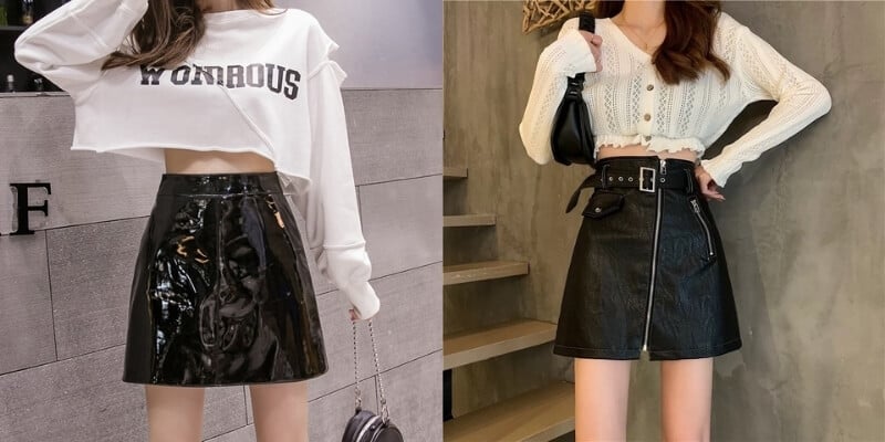 Hai người mặc áo croptop và chân váy đen bóng, tạo kiểu thời trang hiện đại và trẻ trung.