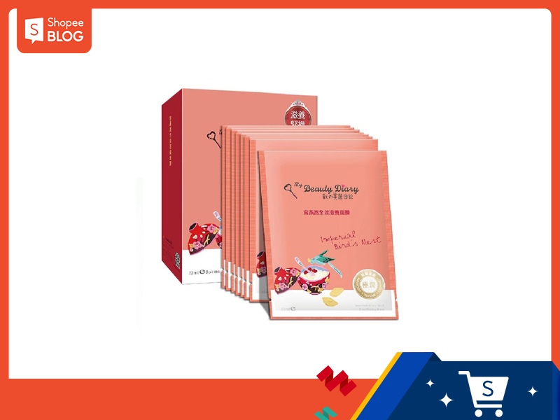 Hộp và các gói mặt nạ dưỡng da màu hồng, trang trí họa tiết sinh động.