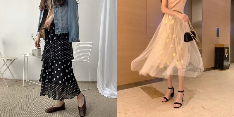 Người mặc váy chấm bi đen trắng và váy voan vàng nhạt, phối với áo khoác denim và giày cao gót.