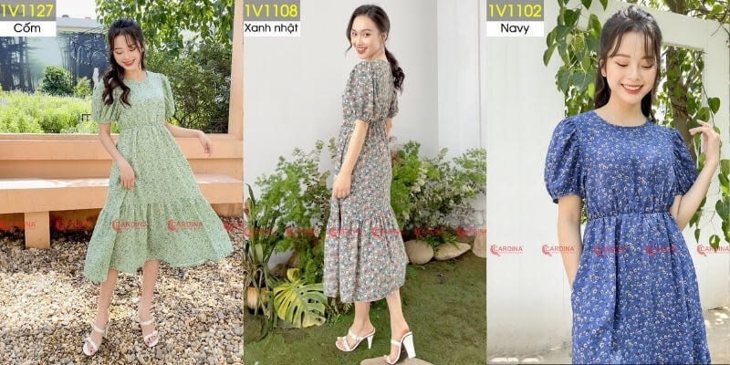 Ba người mẫu mặc váy hoa với ba màu sắc khác nhau: xanh cốm, xanh nhạt và xanh navy, tạo dáng ngoài trời.