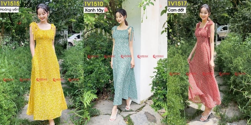 Ba người mẫu mặc váy dài hoa nhí màu vàng, xanh và đỏ, đứng trong khu vườn xanh tươi.