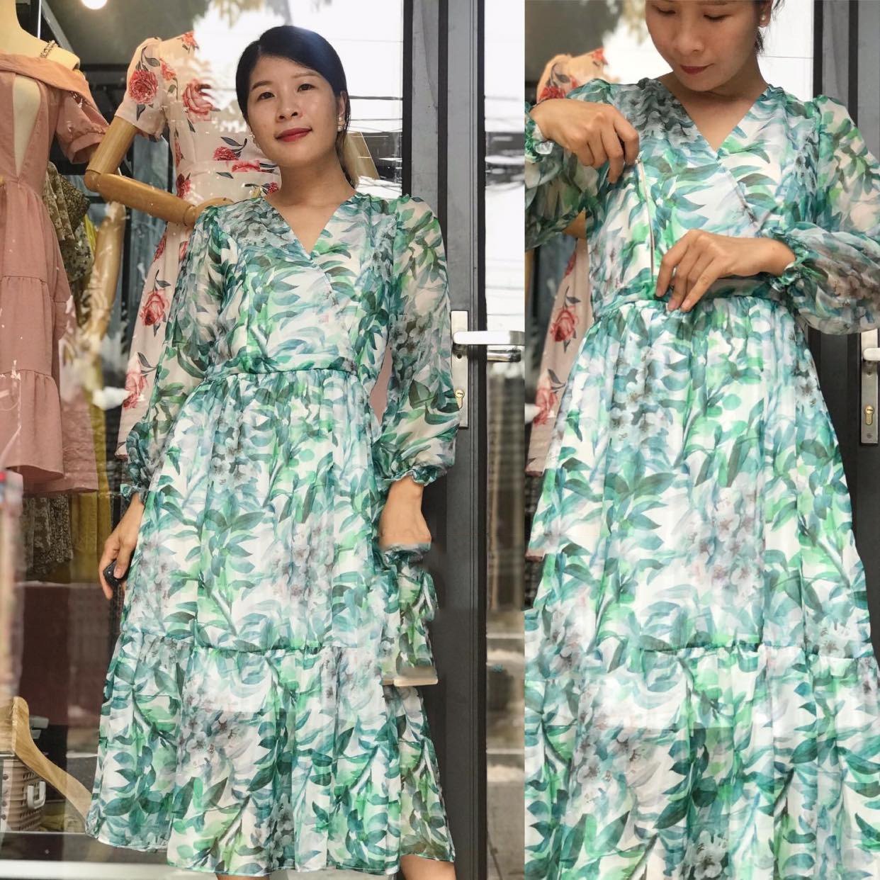 Người mặc váy dài họa tiết lá xanh đứng trước cửa kính, bên trong có nhiều váy treo trên ma-nơ-canh.