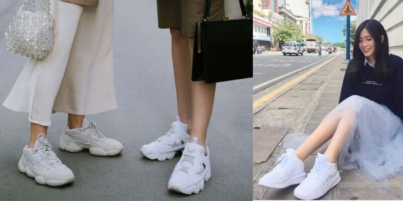 Hình ảnh cho thấy hai người đi giày thể thao trắng và một người ngồi trên vỉa hè với trang phục tông màu sáng.