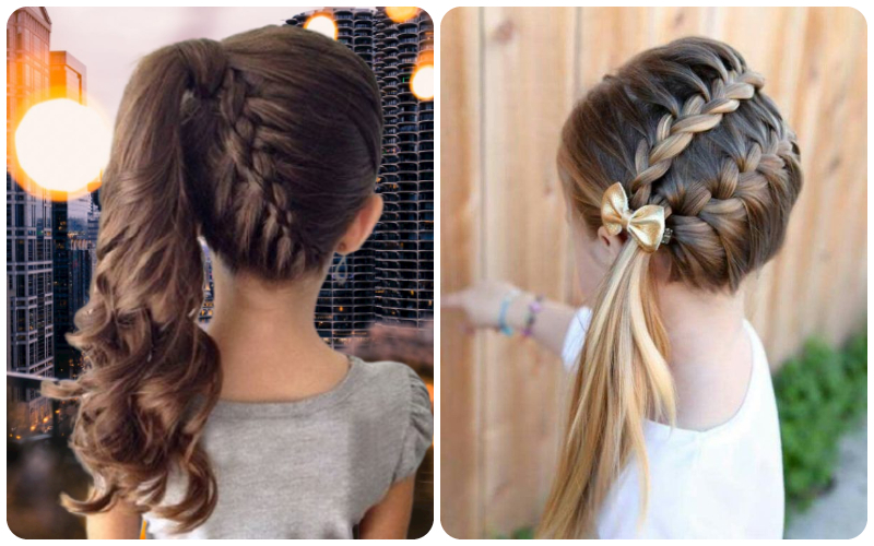 Bím tóc kiểu đuôi ngựa và bím tóc thắt nơ trên hai bé gái, với nền là tòa nhà và hàng rào gỗ.