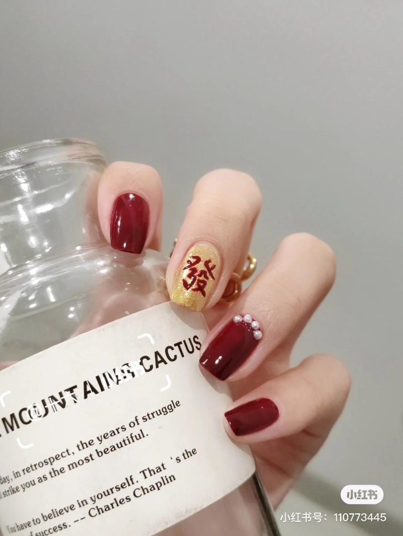 mau-nail-don-tet__27__ddfbe4a276ce4538b548ffb1ccdc9a4d nail tết đỏ sang chảnh